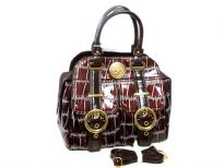 Double strapped PVC Fashion Handbag made with multiple extra outer compartments and buckles. Magnetic closure on top.