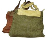 Jacquard fabric handbag made with double shoulder straps and a top zipper closure. 