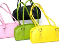 Designer Inspired Handbag has a top zipper closure and double handle. Made of nylon.