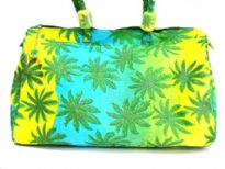 Leaf plant inspired duffle type beach bag. Bag has a double handle and a top zipper closure.  Made of 100% Cotton. 