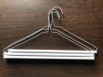 14.5G Laundry Dry Cleaners Strut Hangers. 16 Inches. These are brand new hangers used for pants made of white wire and a white cardboard tube which has adhesive on it to keep the pants from sliding off.  Industrial quality that is made to last. These are 16" wide 14.5 Gauge wire.