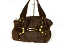 Glossy PVC fashion handbag with straps accent in suede fabric. Double shoulder straps with top zipper closure.