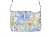 Hand painted metal mesh bag made with a top zipper closure and a detachable shoulder strap. 