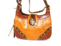 Genuine Leather Studded Two-tone Bag with Embossed Floral Pattern. Double shoulder straps, top zipper closure, outside zipper pocket & cross logo clasp. 
