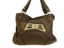 Designer Inspired Shoulder Bag with accentuating metal design. Bag has a zipper closure and a double handle. Made of polyurethane.