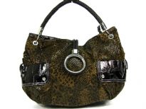 Animal print Fur fashion handbag embellished with a top zipper closure with a hanging bracelet handle and a single shoulder strap.  Outter bold compartments also accentuate this bag. 
