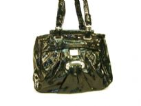 Fashion Handbag is made of polyurethane material. This is a double strap bag with belt buckle like straps with a top zipper closure.