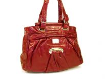 Fashion Handbag is made of polyurethane material. This double strap bag has a belt buckle on both of the straps and a zipper closure on the top.