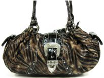 PVC animal print fashion handbag assembled with a front flap along with hardware and studs. Bag has side and inside pocket compartments along with a top zipper closure and double shoulder straps. 