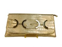 Croco embossed PVC clutch Bag has metal details and a magnetic closure and a an inside zipper closure.