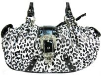 Leopard Print Faux Patent leather handbag has double handle, side pockets, zipper closure topped with a studded belt.