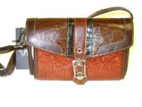 Genuine Leather handbag with flap over zipper closure inside the bag.