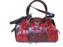 Genuine Leather bag with top zipper closure, double handle & clasp like closure over the top.