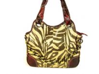 Metallic Zebra Print Handbag with contrasting burgundy colored double straps & patchwork on the front corners of the bag with top zipper closure.