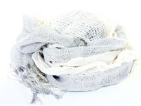Crinkled & ruffled light hued scarf in white color with shiny off-white color running vertically through it in the middle. Fringes on the ends completes this stylish scarf.