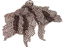 This checkered print black & white 100% polyester scarf can be a perfect accessory all year round. The scarf is stretched in the middle so gives a ruffled look. Imported.