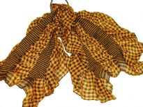 This checkered print mustard & black 100% polyester scarf can be a perfect accessory all year round. The scarf is stretched in the middle with a striped pattern & gives a ruffled look. Imported.