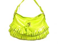 Fashion shoulder bag has a top zipper closure, a single strap and layered frill with stud details on it. Made of PVC.