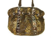 Designer Inspired metallic animal print velvet shoulder bag with drawstring detail. Bag has a zipper closure and a double strap. Made of PU (polyurethane). 