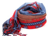 Nautical symbology floats over this 100% wool scarf in blue, red & brown colors. The scarf has boats & anchors print with fringes at the ends. Hand wash. Imported.