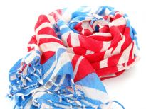 The British flag patterns this finely woven, lightweight wool scarf in ivory, turquoise & red colors with twisted fringe at the ends of the scarf. Imported from India. Dry clean only.