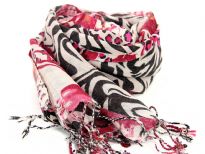 This beige colored wool scarf has alternate waves of leopard and zebra print pattern in black & fuchsia colors with little bit of floral print also. Long twisted fringe at the edges. dry clean only. Imported.