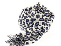 Black & blue leopard spots enliven this ivory colored scarf cast in 100% wool. Decorated with twisted fringe at the ends. Imported. Dry Clean only. 