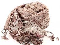 This lightweight & cozy light natural colored wool scarf is patterned with the trendy python print & twisted fringe decorates its edges. Imported. Dry clean only.