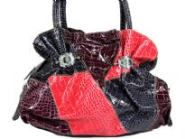 PVC handbag in multi colored patchwork with double shoulder handle, zipper closure.