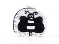 Beaded oval coin purse with bee shape pattern on it. Top zipper closure with wrist strap. Imported. 