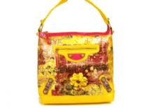 Designer Inspired croco embossed printed bucket handbag with zipper closures and single strap. Bag has an abstract floral pattern design as well as small belt detials. Made of PVC.