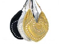 Beautiful hand beaded evening bag with mirrors & beads of different shapes. Top zipper closing with single shoulder strap.