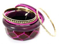 Rich colored attractive 8 piece bangles set has wide cuff diamond pattern bangle, one rounded wooden bangle, 2 fabric bangles, 1 purple resin bangle & 3 gold color each having its own etched design. Hand crafted by experts in India.