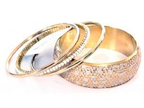 Beautifully designed 4 piece bangles set which has one wide cuff ivory bangle with gold etched design, 2 plain gold colored bangles & a pearls bangle. Gives a classic touch to any kind of outfit & very lightweight. 