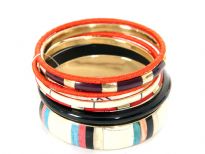 Beautifully designed 7 piece fashion bangles set has one wide bangle in ivory with triple colored stripes pattern, 2 fabric thin bangles & 4 resin bangles in different colors/design. matches with number of outfits any time of the day. 