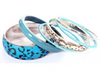 Sober yet artistic 6 piece bangles set has animal print wide cuff bangle, one rounded resin bangle, 2 fabric bangles & 2 colored - one is simple &  other has carved design. Designed & crafted by expert artisans.