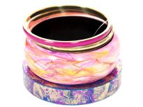 Funky four piece wide bangles set includes abstract print wide cuff bangle in pink/yellow, teal colored thick bangle with fuchsia/gold glitter & two bangles in fuchsia/gold colors. 