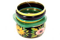 Floral print wide cuff bangle with six solid bangles makes this colorful seven pieces bangles set. Two yellow colored resin bangles, two green thread bangles, one medium thickness black bangle & one square shape green resin bangle. 