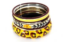 This attractive seven pieces bangles set includes one animal print wooden bangle, one floral hand painted resin bangle, three thread covered thin bangles, one yellow resin bangle & one gold colored metal bangle. Imported.