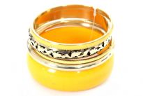 This is a 5 piece bangle bracelet set. Hand painted by experienced artisans. This piece features one wide bracelet in Yellow color along with smaller pieces in Gold and Yellow. Imported.