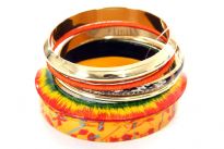 Intricately designed 6 piece exotic bangle bracelet set in Orange and Gold motifs. Hand painted by experienced artisans. Imported.