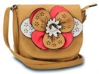 Faux leather crossbody small bag has a large floral detail with contrasting colors. Bag has an adjustable strap, top zipper closuer and front flap closure. Made of faux leather.