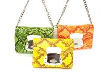 Designer inspired shoulder bag has a magnetic closure, a chan strap and an animal print pattern. Made of faux leather.