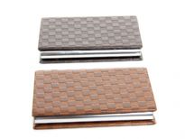 Checker embossed business card holder. Magnetic snap closing.