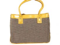 PVC Fashion Handbag has a plaid pattern and yellow trim. Top zipper closure and double handle.
