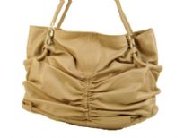 Spacious fashion shoulder bag has a ruched front, top zipper closure and a double handle. Made of PU.