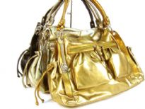 Designer Inspired Metallic Shoulder Bag with top zipper closure, double shoulder straps, two side open pockets with drawstring closure & two front zipper pockets. Chain accents in the front. Made of PU (polyurethane).
