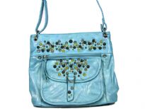 Studded shoulder bag has a top zipper closure, outside pockets and an adjustable single strap. Made of faux leather.