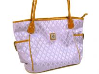 Fleur De Liz Licensed Jacquard Handbag. This spacious broad bag with two side pockets with button closure has leather trim bordering the bag & has double handle. Top zipper closure.