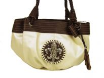 Fleur De Liz Licensed PVC Handbag with braided double handle, hanging tussle in the front, broad leather trim on the top in contrast color. Fleur De Liz logo in the center with studded rhinestones.